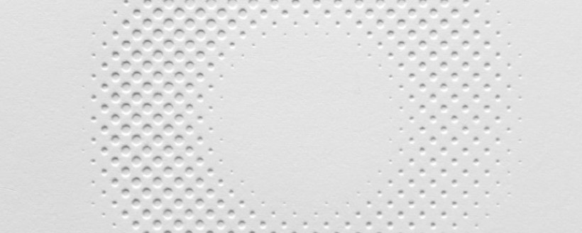 The blind-embossed White Rainbow logo, in detail.